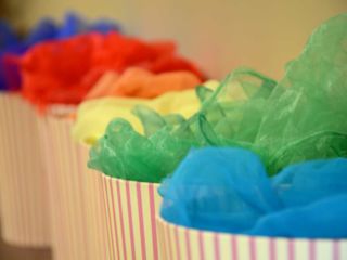 Coloured scarves in buckets at WELL